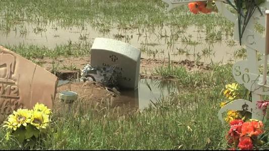 Image of sunken headstone in Loving, NM cemetery from KOB News.